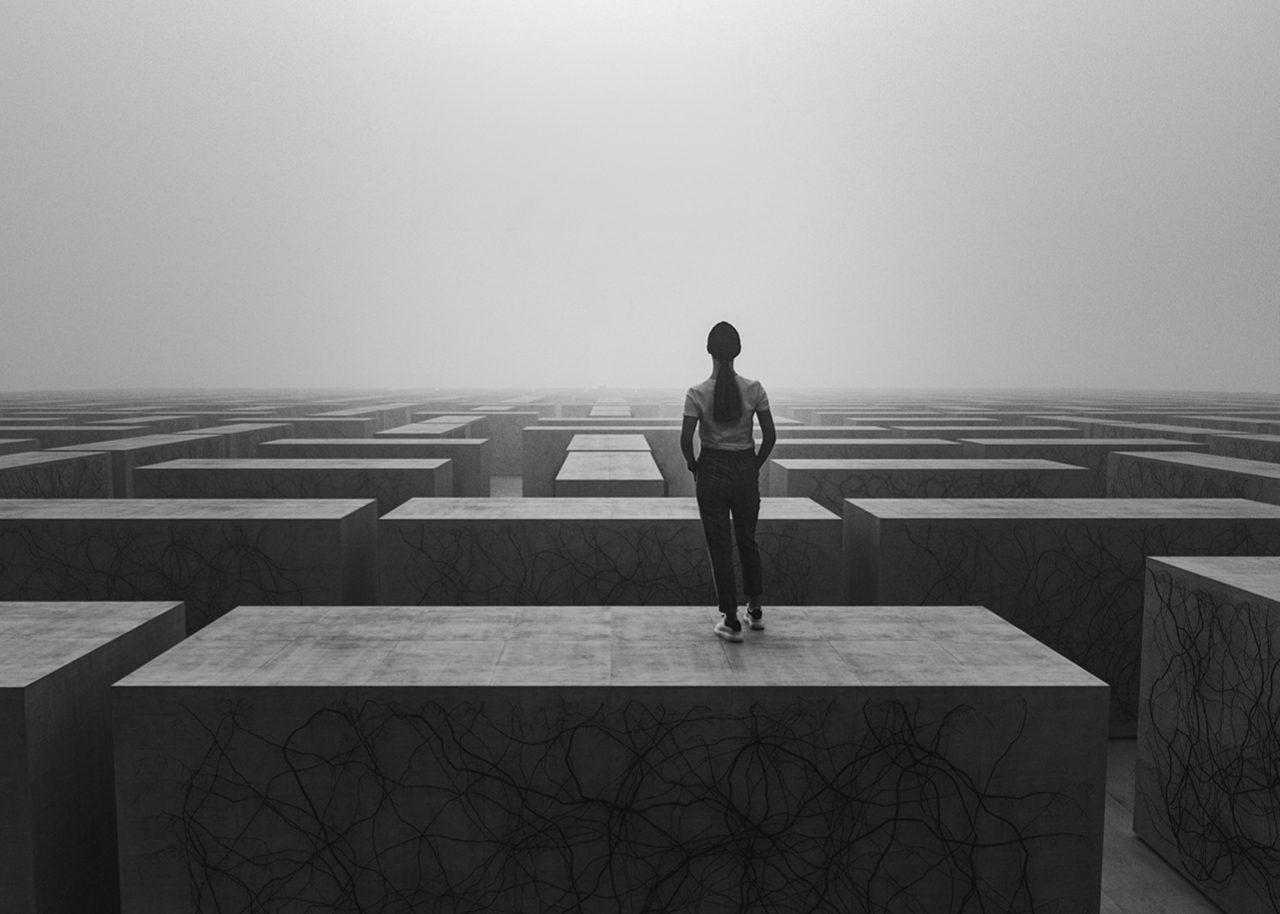 Guy standing on stairs of overgrown structure